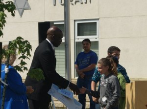 Sargeant Ray Wilson was presented with a card a tree in appreciation of his service to the EPS Hate Crimes Unit.