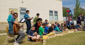 The Grade 6 class, with their teacher Ari Sniderman, performed during the ceremony.